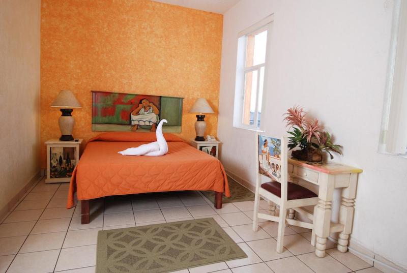 Hotel & Suites Galeria Morelia Quarto foto
